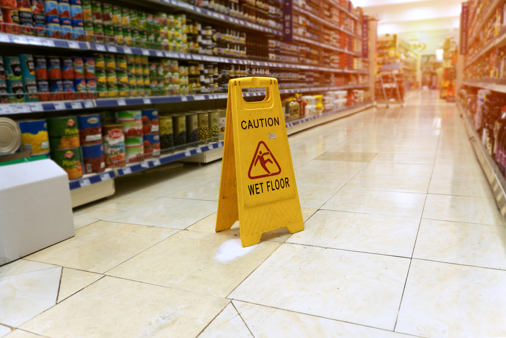 Wet floor caution sign in Florida grocery store