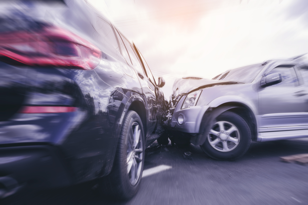 Two cars crashing into one another