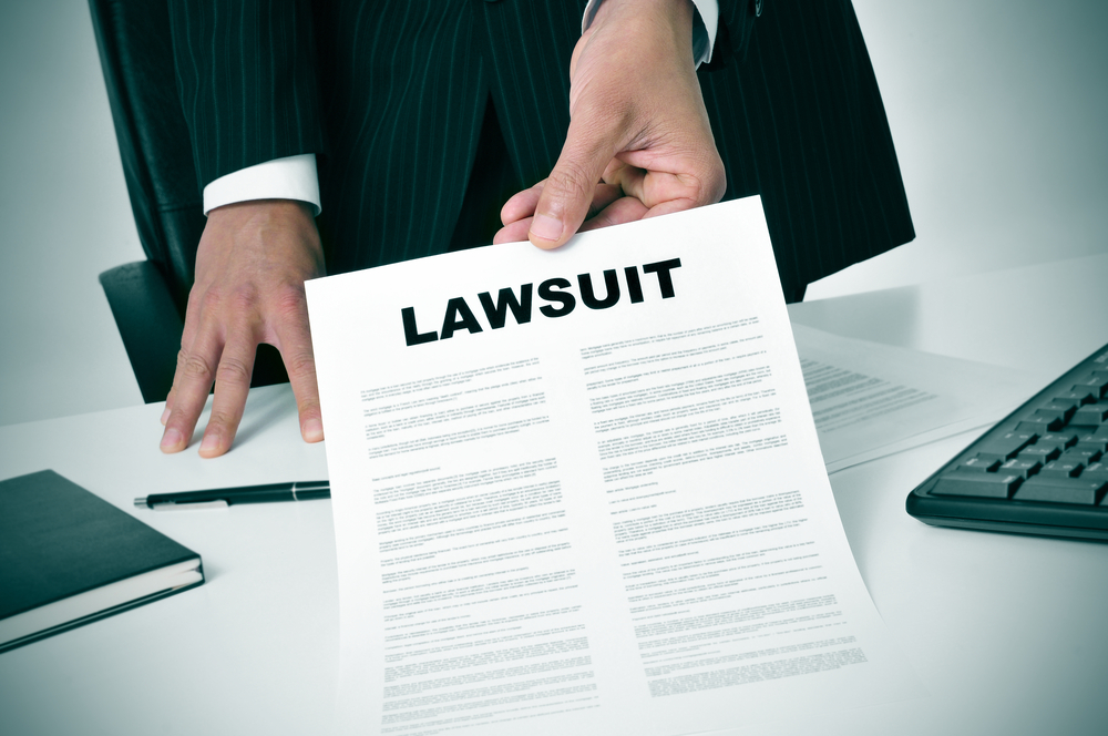 Premises liability lawyer showing client lawsuit paperwork in Florida