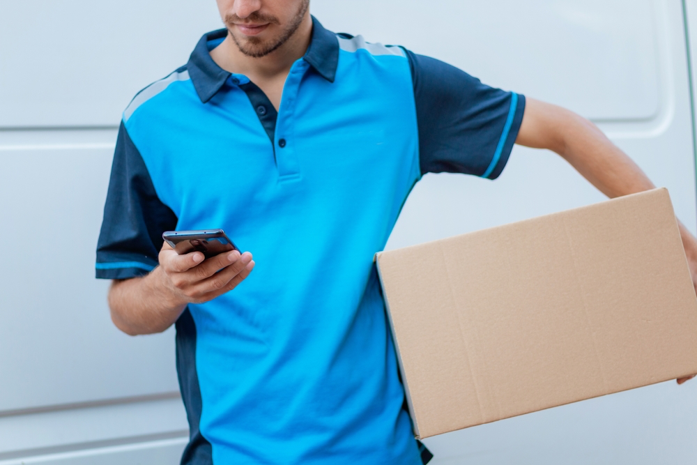 Amazon driver with a package in his hands